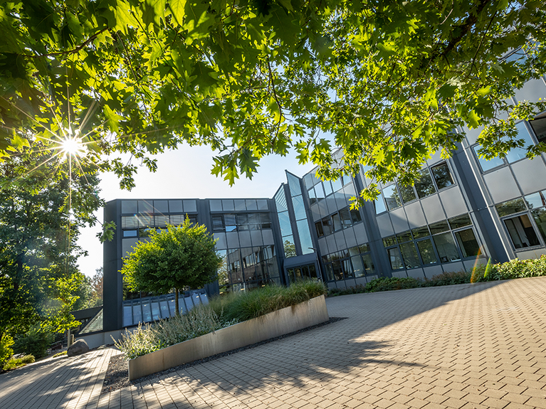 PROBAT Headquarters viewed from the front The PROBAT administration building, the main entrance framed by a tree
